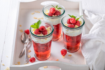Creamy red jelly as a fruit dessert with cream.