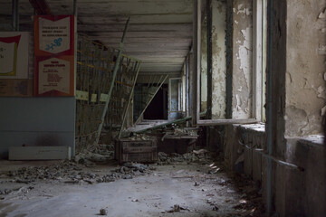 Fototapeta na wymiar Corridor in an abandoned school in Pripyat