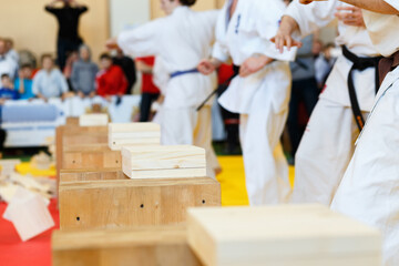 Martial artists breaks the wooden boards by hand
