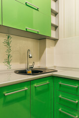 green kitchen sink with faucet
