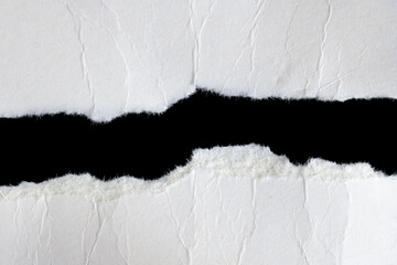 a white piece of paper on a black isolated background