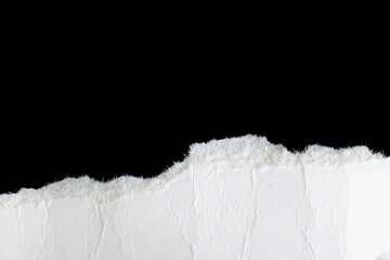 a white piece of paper on a black isolated background