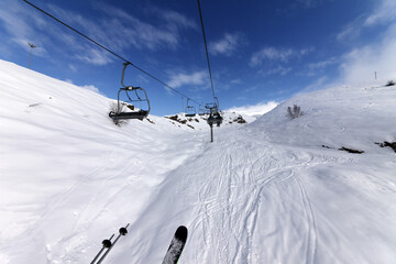 Fototapeta na wymiar Chair-lift at ski resort