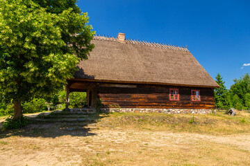 Fototapeta na wymiar Thatched cottage in open-air museum, Wdzydze Kiszewskie, Poland.