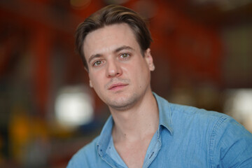 Obraz premium Portrait of a young handsome confident on casual outfit standing outdoor.
