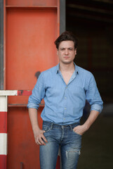 Portrait of a young handsome confident on casual outfit standing outdoor.