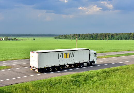Semi-trailer truck by DWT logistics driving on highway. Traffic on motorway and road. Logistics of transportation and delivery of goods. Transport logistics in Europe. Russia, Smolensk, JUN 20, 2021.