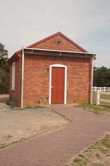 Naklejka premium Orange and Red Brick Utility Shed for Hatteras Lighthouse