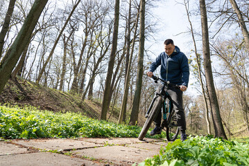 Naklejka premium Man riding a mountain bike