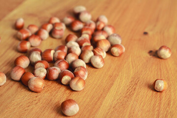 hazelnuts on wooden background