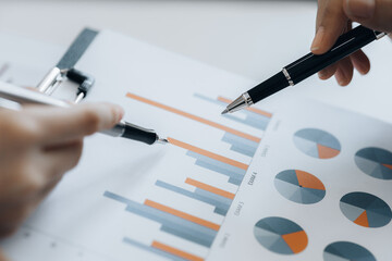 The sales department is having a monthly summary meeting to bring it to the department manager, they are verifying the correctness of the documents that are prepared before bringing in to the manager