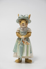 White Easter bunny rabbit with shopping basket and painted eggs on blue and pink background