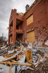 Fototapeta premium Bila Tserkva, Kyev region Ukraine - 04.03.2022: The consequences of an airstrike, a missile attack on residential buildings in Bila Tserkva. Russian troops destroy houses, people in Ukraine.