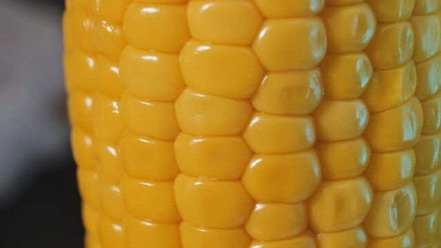 Texture of yellow grains of corn cob, background food organic close-up.
