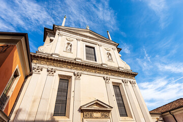 Fototapeta na wymiar Brescia downtown. Facade of the ancient church of Santa Giulia (holy religious martyr) with the statues of San Biagio and San Benedetto, in Renaissance Style, 1593-1599. Lombardy, Italy, Europe.