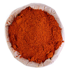 paprika in a paper bag on a white background