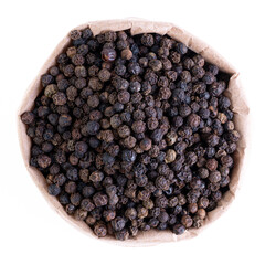black peppercorns in a paper bag on a white background
