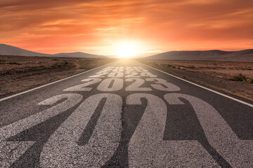 Desert landscape with the years 2022, 2023, 2024, 2025 and 2025 written on highway road  at the...