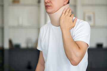 Man wearing a neck brace, cervical orthopedic bandage