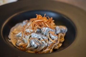 Black truffle spaghetti served on plate