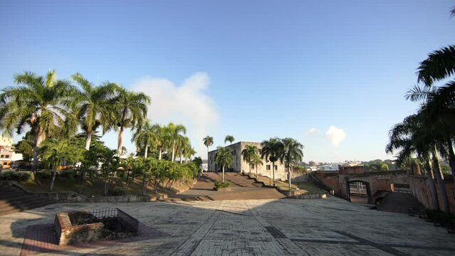 Alcazar de Colon side view at sunrise. Plaza de la Hispanidad or Spain with no people early morning. Popular tourist landmark in Colonial city of Santo Domingo, Dominican Republic. 
