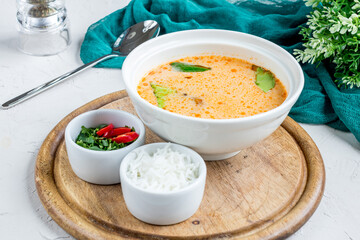 Tom Yam soup with seafood and rice on the board