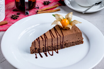 Chocolate cake slice on a white plate