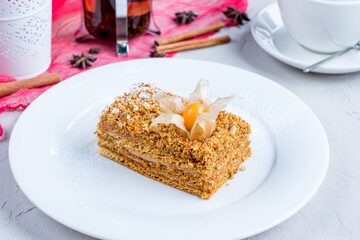 a piece of honey cake on a white plate