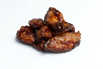 Fried chicken wings and thighs. On a white background.