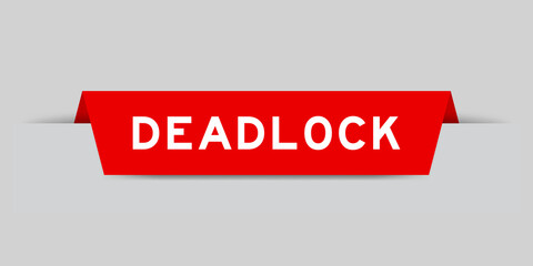 Red color inserted label with word deadlock on gray background
