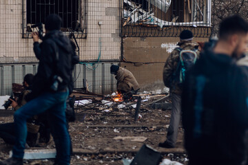 Kyiv, Ukraine - March 20, 2022:War of Russia against Ukraine. A residential building damaged by an enemy aircraft in the Ukrainian capital Kyiv. Cleaning up debris