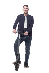 Fototapeta premium smiling young man with an electric scooter .