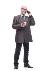 smiling business man with a smartphone and a takeaway coffee.