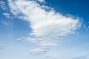 Cloudscape with white cloud and blue sky.