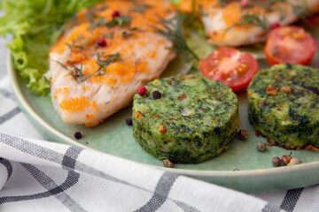Green vegetable cutlets of beans, broccoli and spinach with fried fish. Healthy food, proteins, omega, fiber, vitamins.