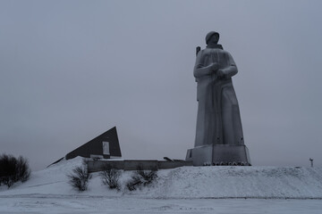 View of Monument to the Defenders of the Arctic (the main symbol of the town) on short winter day. Murmansk, Russia.