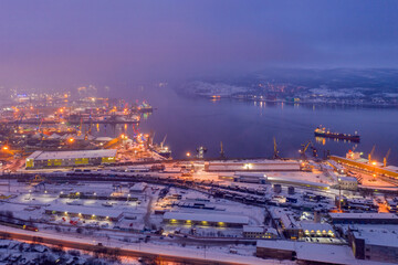 Obraz premium Aerial view of the town and Sea port on polar night. Murmansk, Russia.