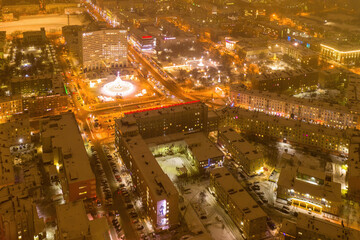 Fototapeta na wymiar Aerial view of the town and Five Corners square with Christmas tree on polar night. Murmansk, Russia.
