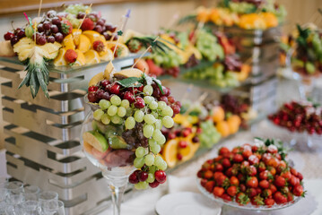 Various fruits beautifully decorated on the buffet table for the celebration