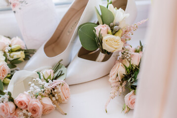 Brides wedding accesories, ring, bouquets and invitation card on flat lay wedding day