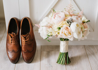 Grooms accessories for wedding, rings, shoes, bowtie and bouquets in the morning