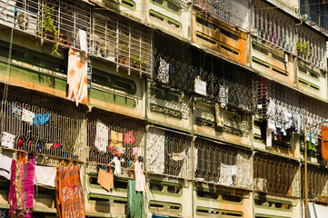 Apartment building in India with laundy in the windows