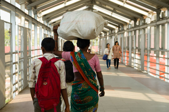 Woman Carrying Sack On Her Head At Chhatrapati Shivaji Terminus Railway Station