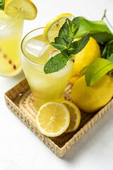 Fresh Lemonade or mojito cocktail with lemon, mint and ice