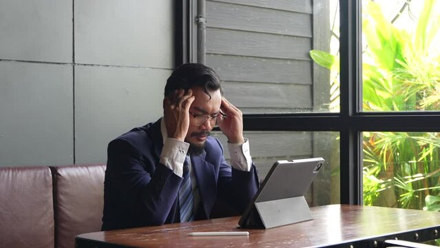 Businessman suffering from stress from congenital disease