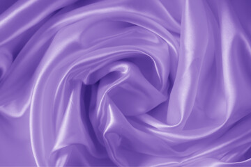 Obraz premium The texture of the proton purple cloth with waves and shrugs. Shiny fabric.