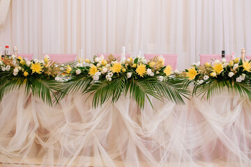Stylish decorated wedding tables with flowers