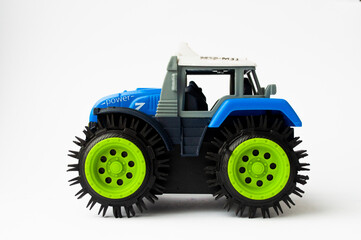 children's tractor on a white background, children's toys