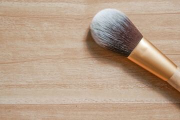 Makeup brushes isolated on wooden background. Beautiful makeup brush.
