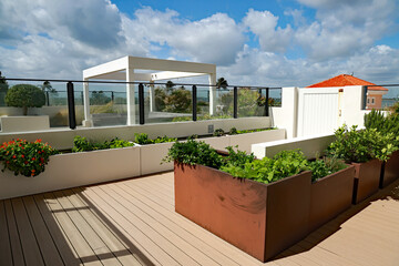 A home garden using planters on an outdoor raised terrace at a condo, with vegetables and herbs.